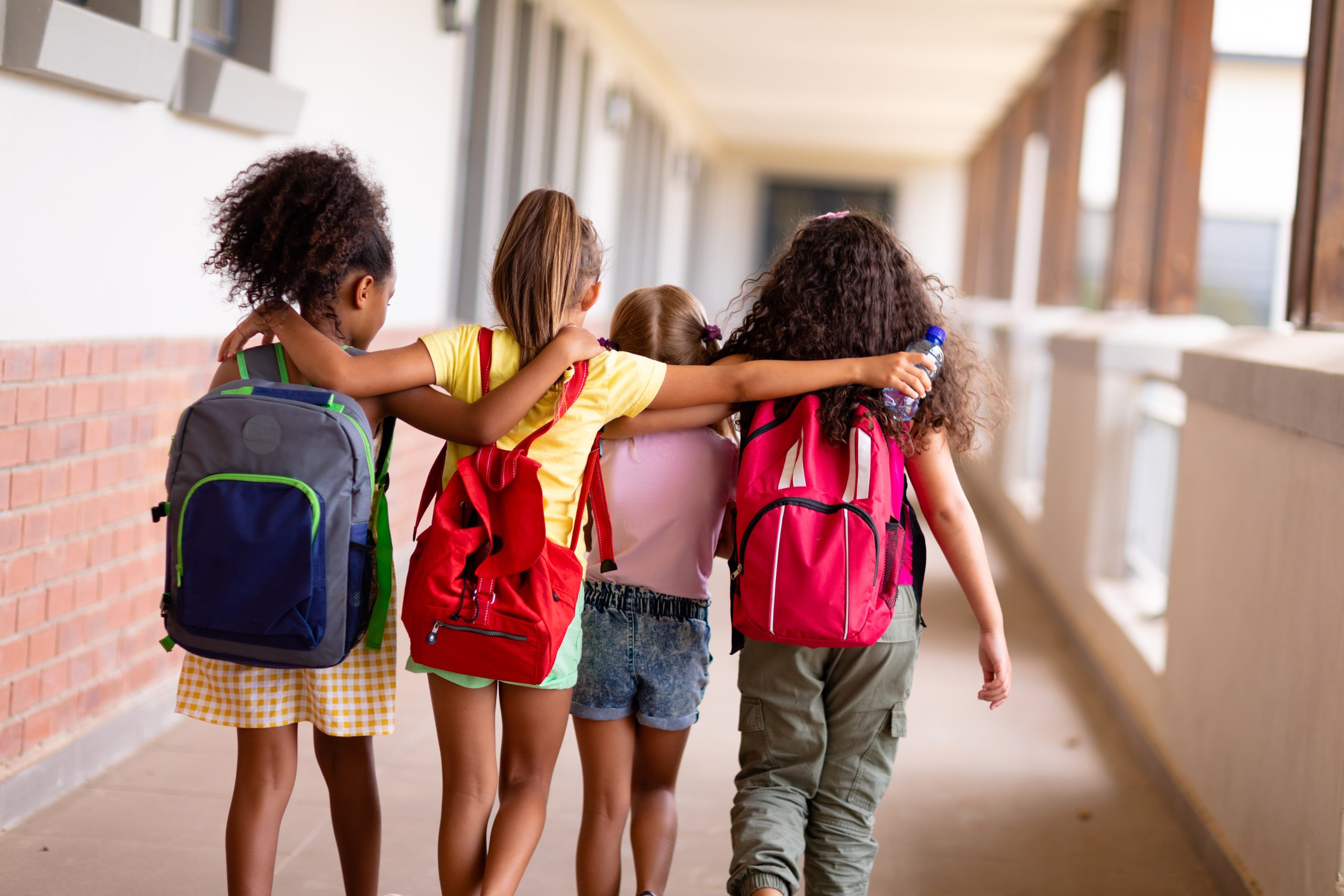 Back to school students with backpacks for lice prevention checklist