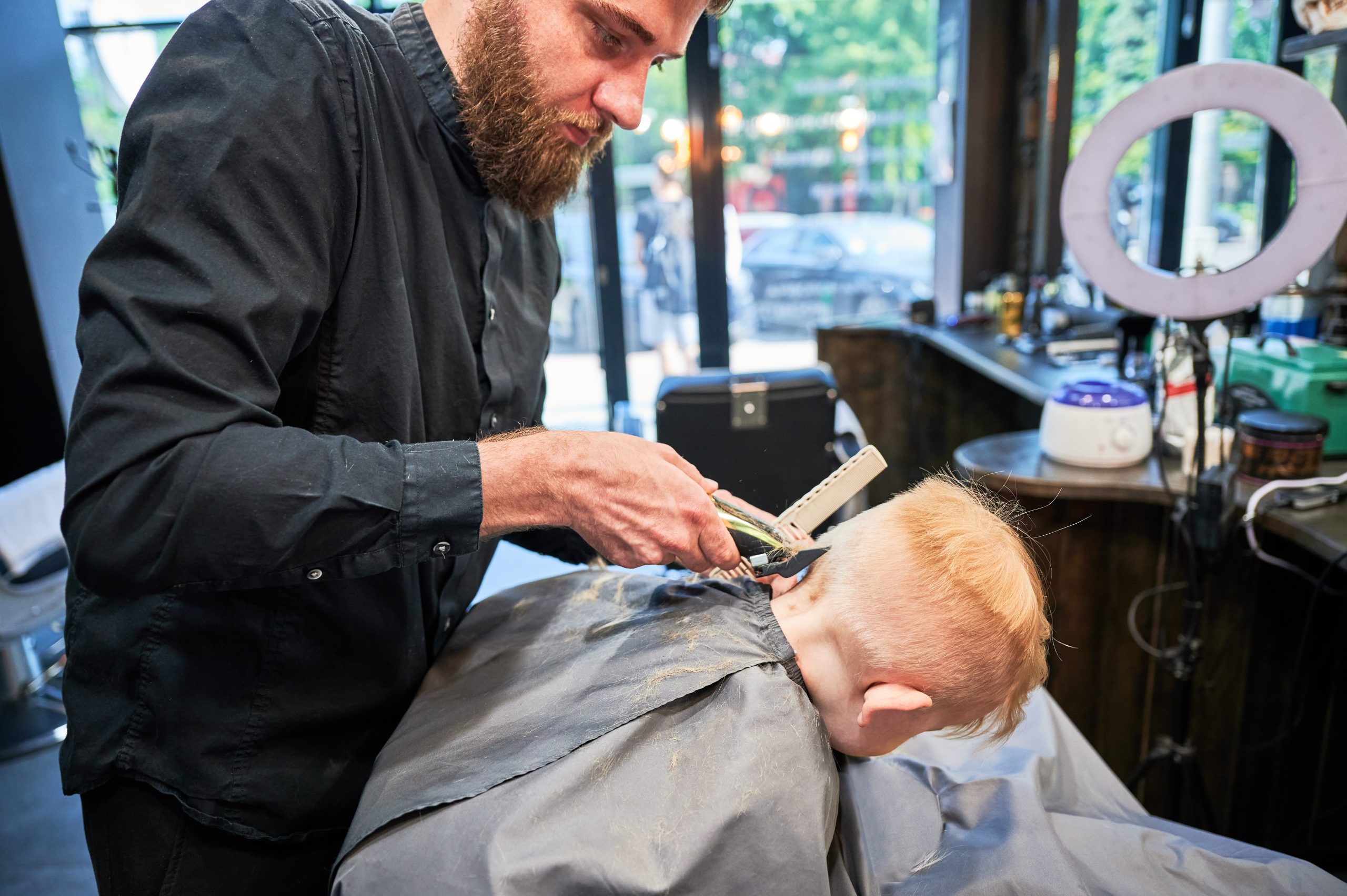 Child haircut and clippers for shaving head lice article